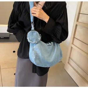 Casual light blue denim crescent shoulder bag set with small round coin purse