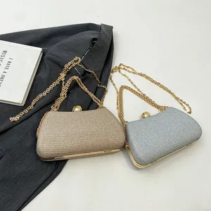 Elegant glitter hard shell evening clutch bag with pearl clasp and gold chain strap