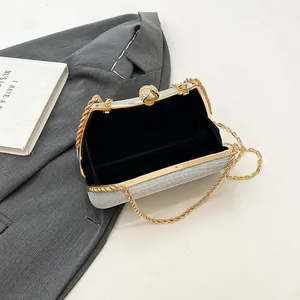 Silver glitter evening clutch bag with gold chain and pearl jeweled clasp for women
