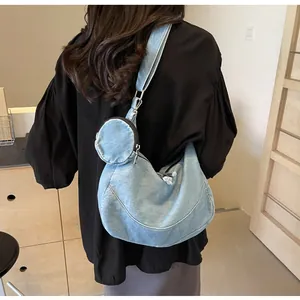 Stylish blue denim crescent shoulder bag for women with small matching round pouch