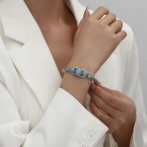 Vintage bohemian adjustable cuff bracelet with turquoise stones and engraved floral details