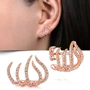 Rose gold curved multi-line ear crawler earrings with sparkling stone inlay.