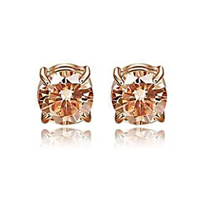 Close-up of champagne zircon magnetic stud earrings with rose gold four-prong setting