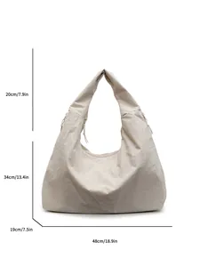 Bolso hobo grande de lona beige con dimensiones detalladas del producto y vista estructural