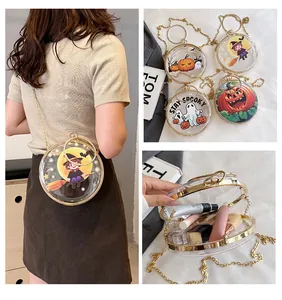 Detail view of unique transparent round crossbody bag featuring Halloween prints and gold chain