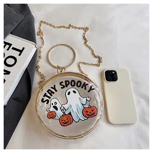 Detailed view of a round transparent Halloween ghost and pumpkin crossbody chain bag