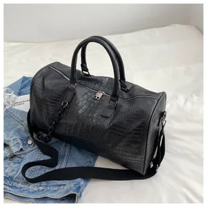 Large black crocodile embossed leather travel bag for gym and weekend trips detail