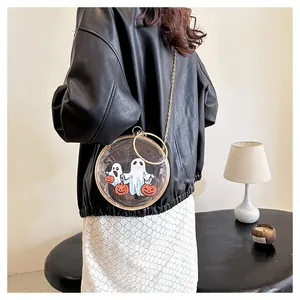 Unique transparent round crossbody bag with ghost and pumpkin print on a model