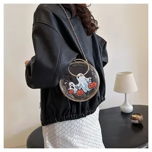 Transparent round PVC handbag featuring Halloween ghost prints and a gold chain strap