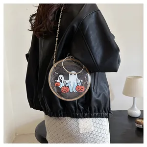 Detail view of transparent round crossbody bag with ghost and pumpkin prints