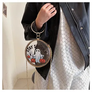 Detail of transparent round crossbody bag with ghost and pumpkin Halloween print