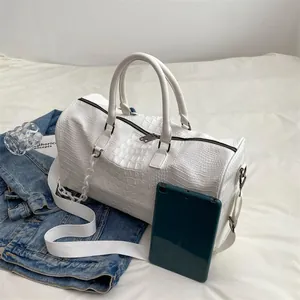 Stylish large white crocodile-textured travel duffle bag for gym and weekend trips.
