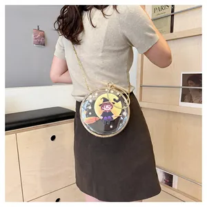 Back view of a transparent round crossbody bag with a cute cartoon witch design.