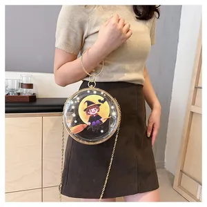 Transparent circular crossbody bag with cartoon witch design and gold chain strap