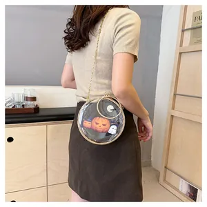 Model wearing a transparent round Halloween shoulder bag with pumpkin and ghost print