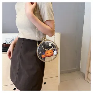 Close-up of transparent round Halloween crossbody bag with pumpkin and ghost prints.