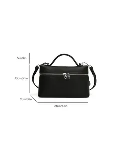 Detailed view of black minimalist box crossbody bag showing dimensions 21cm x 13cm x 7cm