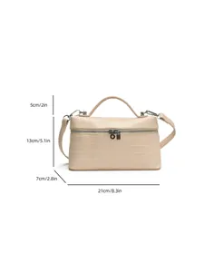 Detailed dimensions of a beige crocodile pattern box bag with crossbody strap.