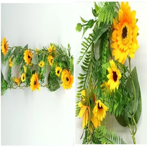 Detailed close-up of artificial sunflower vine with realistic yellow petals and green leaves