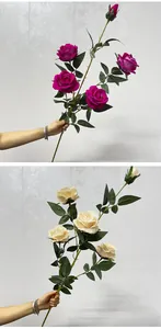 Close-up of artificial velvet roses in magenta and cream for wedding home decor