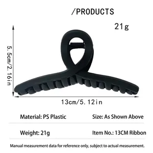 Detailed view showing dimensions of the matte black shark hair claw clip, 13cm long.