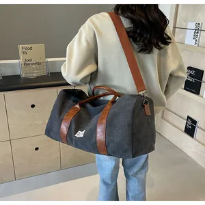 Große dunkelgraue Canvas-Reisetasche für Damen mit modischen braunen Lederriemen