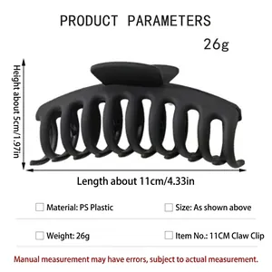 Detailed view of matte black shark hair claw clip with 11cm length and size specifications