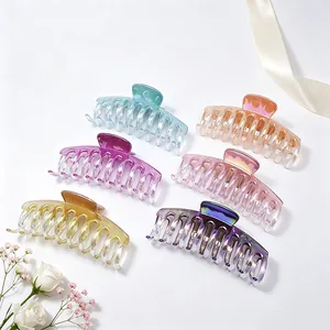Set of six colorful gradient UV electroplated hair claw clips displayed with white flowers