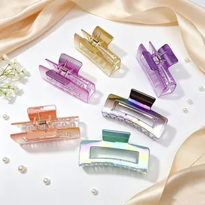 Detailed macro view showing a variety of colorful UV electroplated gradient hair claw clips