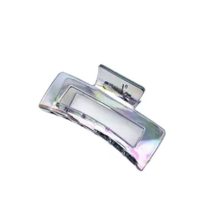 Iridescent electroplated medium hair claw clip showing a glossy holographic texture finish.
