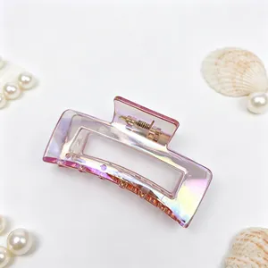 Detail of iridescent electroplated hair claw clip with elegant rectangular design.