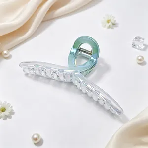 Close-up detail of the elegant iridescent UV-plated 13cm ribbon-style hair claw clip