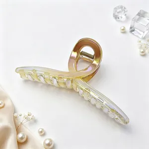 Elegant 13cm iridescent UV plated ribbon hair claw clip displayed with pearls and silk
