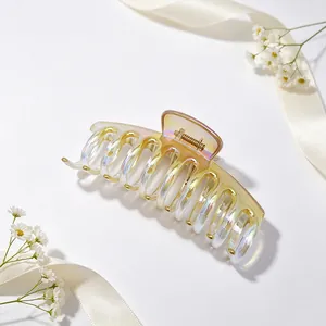 Detailed macro view showing UV-plated jelly gradient texture of the dragon bone hair claw clip.