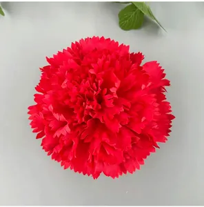 Detailed macro view of a vibrant red artificial carnation flower head for wedding DIY.