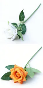 Detailed view showing realistic white and orange artificial silk roses for home decoration