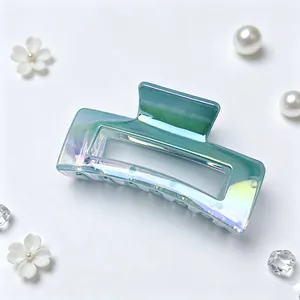Close-up of iridescent square hair claw clip with UV electroplated gradient finish