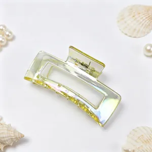 Elegant iridescent yellow hair claw clip with electroplated finish shown in detail