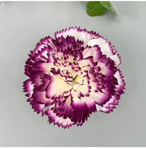 Close-up of artificial purple and white carnation flower head with serrated petals