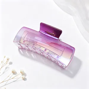 Close-up detail of a large purple gradient square hair claw clip for elegant hair styling