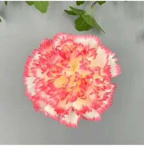 Detailed macro view of an artificial pink and white carnation flower head for decoration