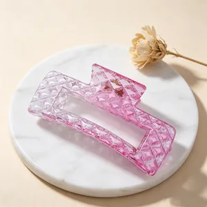 Detailed macro view showing the pink gradient texture of the square hair claw clip