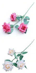 Close-up detail of multi-head artificial roses in pink and cream for wedding decoration