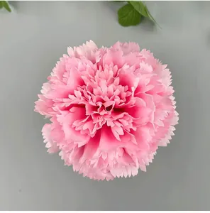 Macro view of a delicate pink artificial carnation flower head for wedding DIY decoration