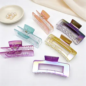 Close-up detail of various large UV-plated square hair claw clips in vibrant gradient colors.