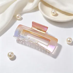 Detailed macro shot of large UV plated square hair claw clip in gradient AB colors