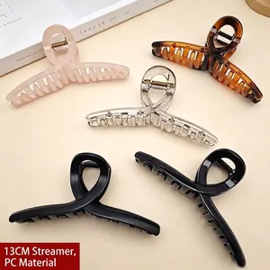 Close-up of 13cm large PC hair claw clips in various colors for thick hair