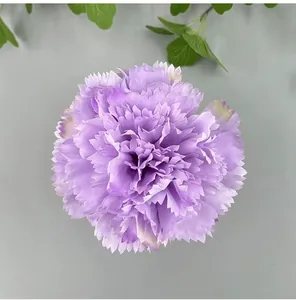 Close-up of a purple artificial carnation flower head for DIY wedding decor and home styling.