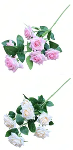 Close-up detail of multi-headed artificial silk roses in pink and cream colors