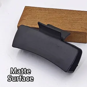 Detailed macro view of an 11cm matte black square hair claw clip base for DIY crafts